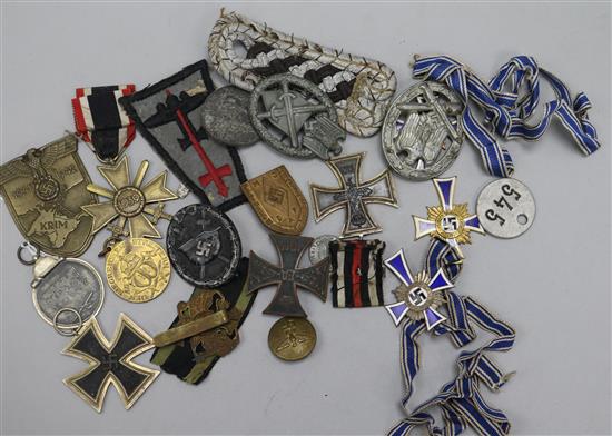 Three German 'Mutterehrenkreuz', a 'Winterschlact Im Osten' medal,  Merit Cross, Black Wound badge and sundries